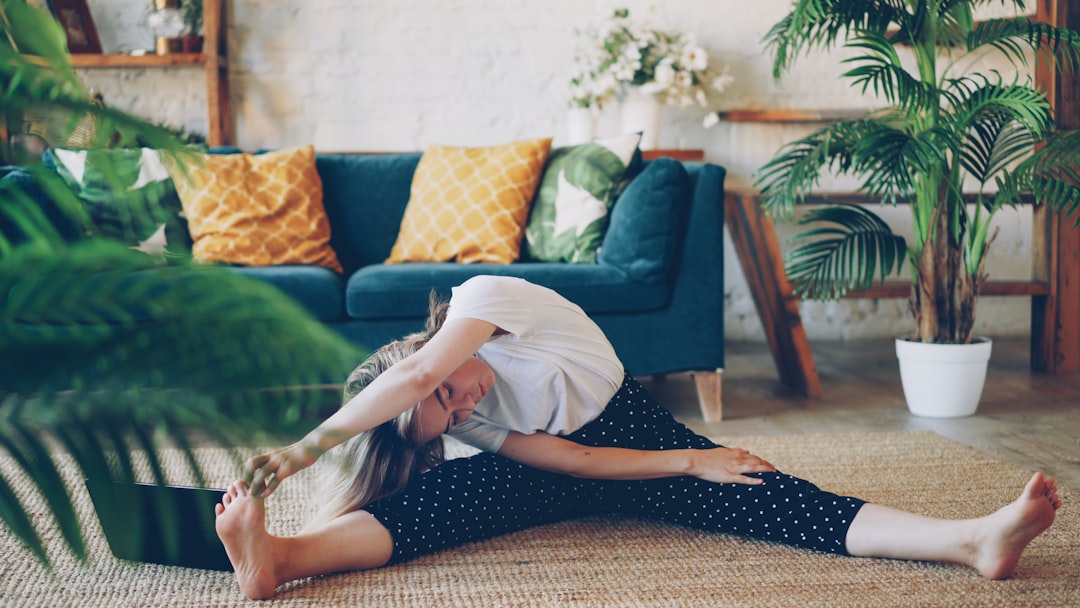 Woman stretching on floor in a living room