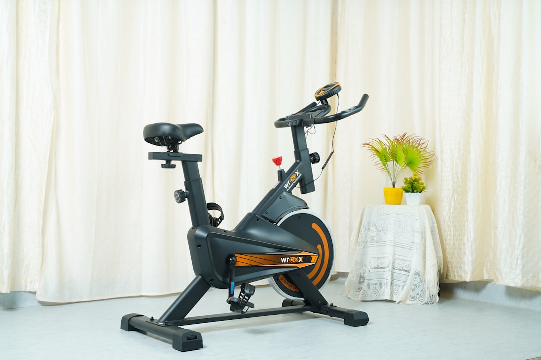 a stationary exercise bike in front of a curtain